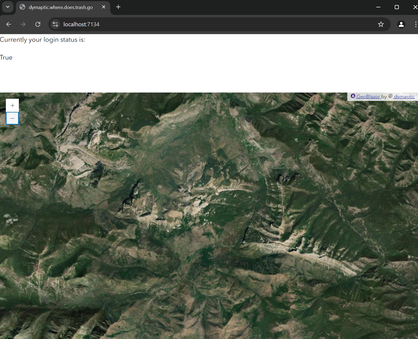 Browser showing the working updated website with a GeoBlazor map displaying satellite imagery of mountainous terrain